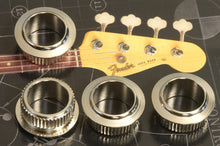 Load image into Gallery viewer, Fender USA Vintage Nickel Bass Tuner Headstock Bushings, Set of 4, 0019509049
